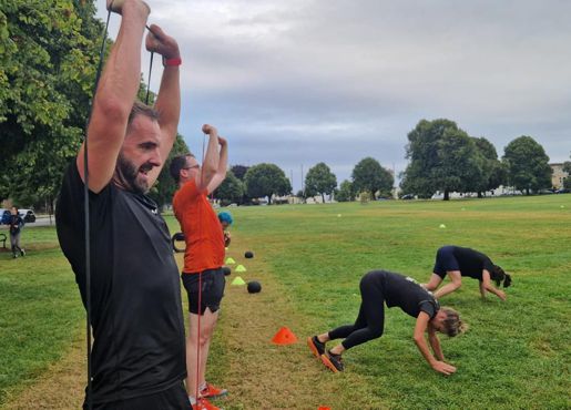 Photo of members exercising with bands